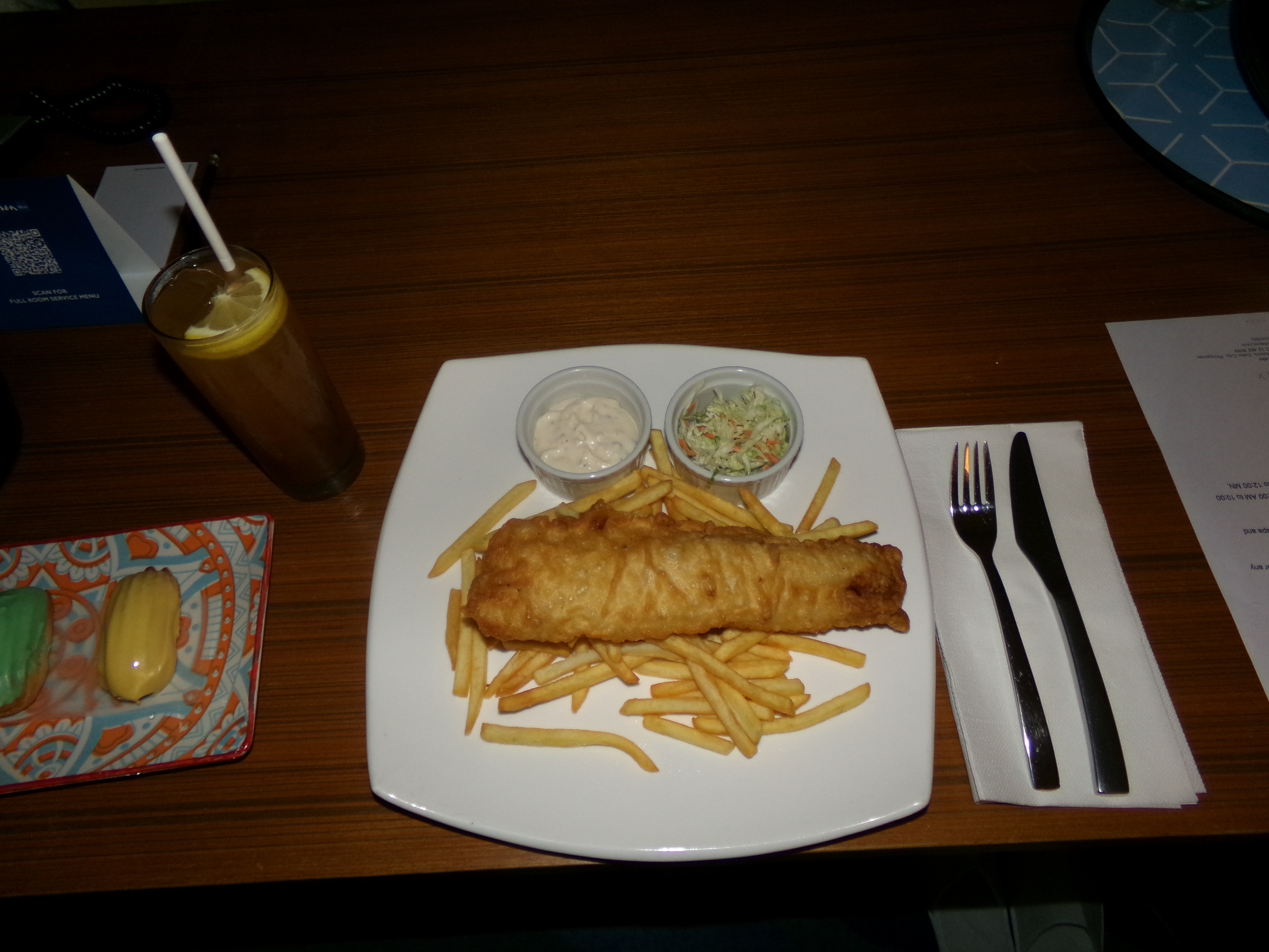 An image of Fish 'n Chips served on a white plate by roomservice