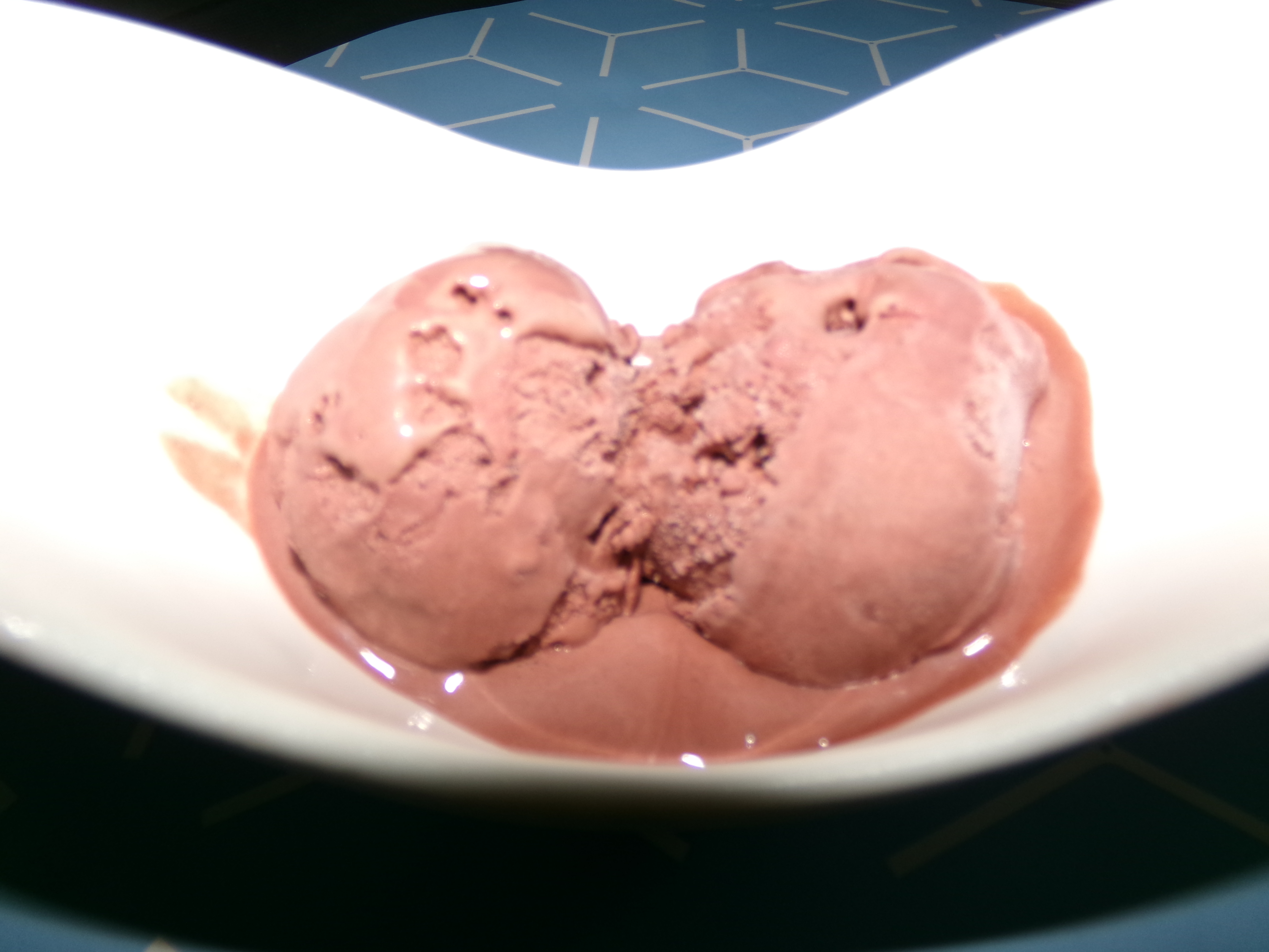 An image of 3 scoops of chocolate ice cream